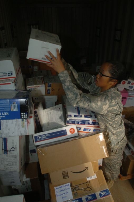 Army Pfc. Sorts Packages at Forward Operating Base in Iraq