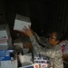 Army Pfc. Sorts Packages at Forward Operating Base in Iraq