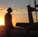 Apache Longbow Crew Chief Prepares Helicopter for Night Mission in Iraq