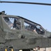 Apache Longbow Crew Chief Prepares Helicopter Gunship for Mission in Iraq