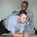 Army Trainer Helps Soldier Stay Fit at Camp Victory