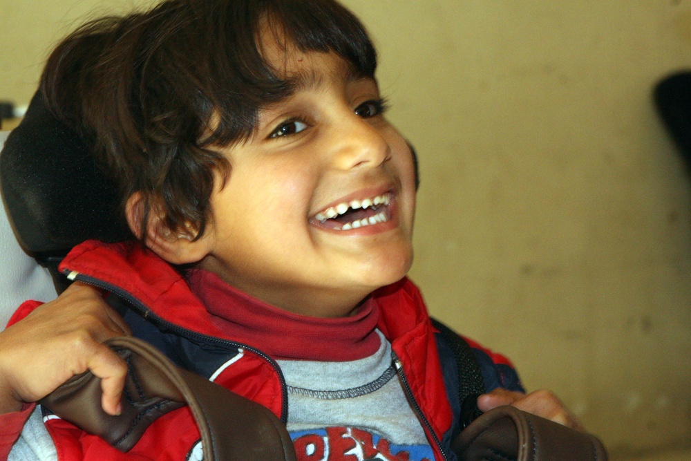 Iraqi Boy Receives New Wheelchair with Joy