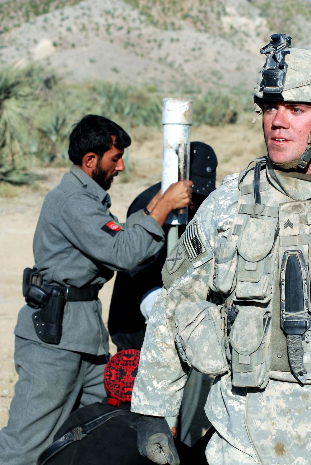 U.S. Soldier Assists Afghan Border Police at Traffic Control Point