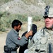 U.S. Soldier Assists Afghan Border Police at Traffic Control Point