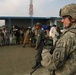 U.S. Soldier Provides Security with Afghan Police After First Aid Training