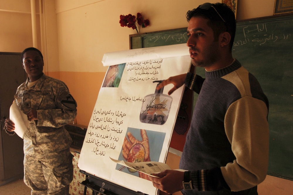 U.S. Army Medic and Iraqi Doctor Promote Health Awareness at Baghdad School
