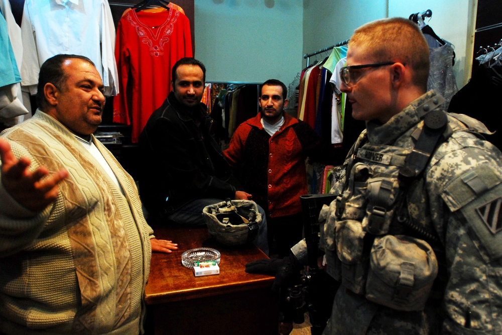 Army Officer Listens to Baghdad Shop Owner's Concerns During Patrol