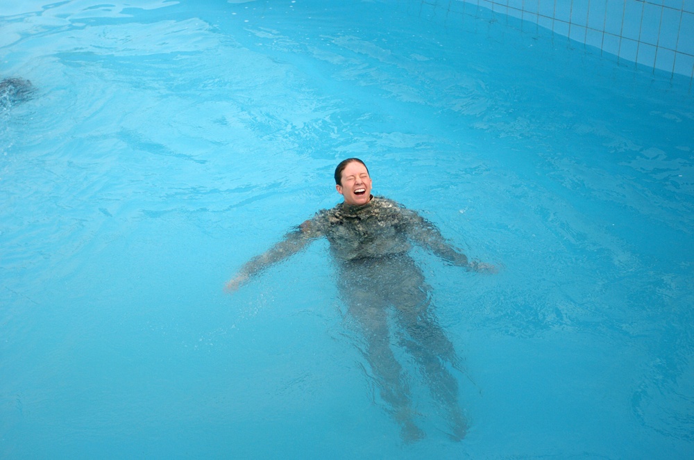 Army Captain Swims with Iraqi Children at Zawra Park Pool Opening