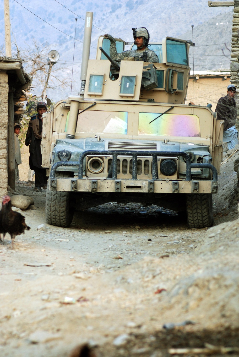 Texas Soldier Guides Humvee Through Afghan Village