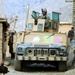 Texas Soldier Guides Humvee Through Afghan Village