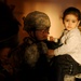 U.S. Soldier Comforts Child During Baghdad Clearing Operation