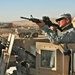 Soldier Cleans Rifle During Patrol in Afghanistan