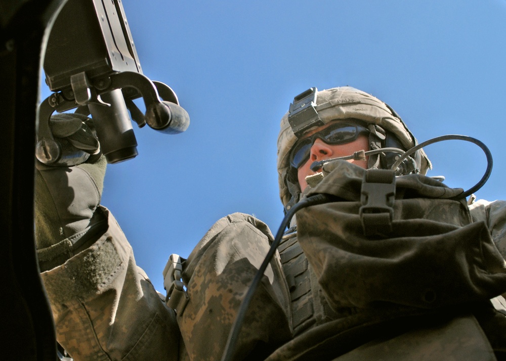 U.S. Soldier Mans .50-Caliber Turret Gun During Afghan Police Convoy