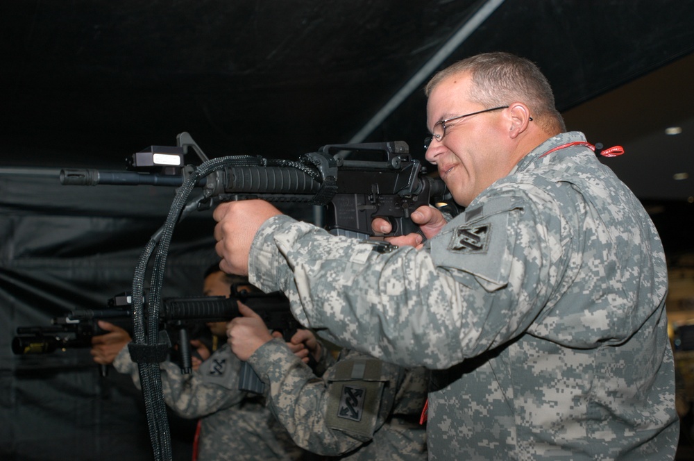 Soldier Responds to Simulated Sniper Attack at Training Conference