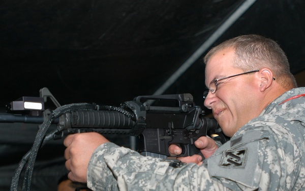 Soldier Responds to Simulated Sniper Attack at Training Conference