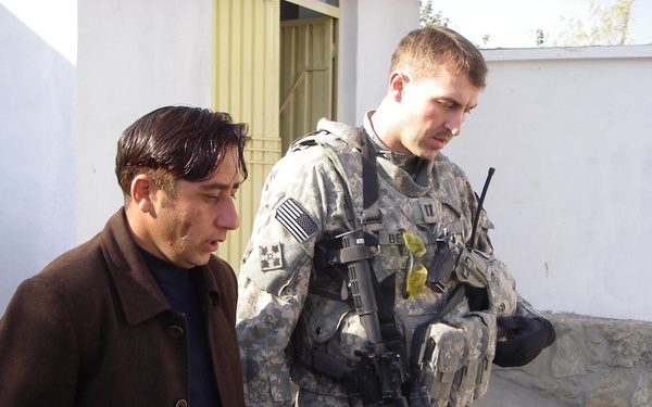 U.S. Army Captain Speaks with Afghan Clinic Contractor Ahead of Ribbon-Cutting Ceremony