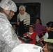 Army Officer Distributes Backpacks to Iraqi Students