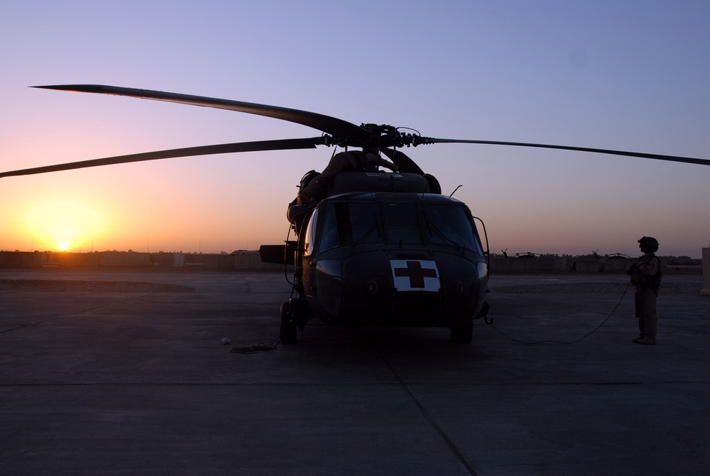 Army Aviation Crew Conducts Preflight Checks on Black Hawk Helicopter