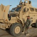 Soldier Inspects New Mine-Resistant Vehicle at Camp Liberty