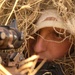 Airman Demonstrates Camouflage Tactics in Iraq