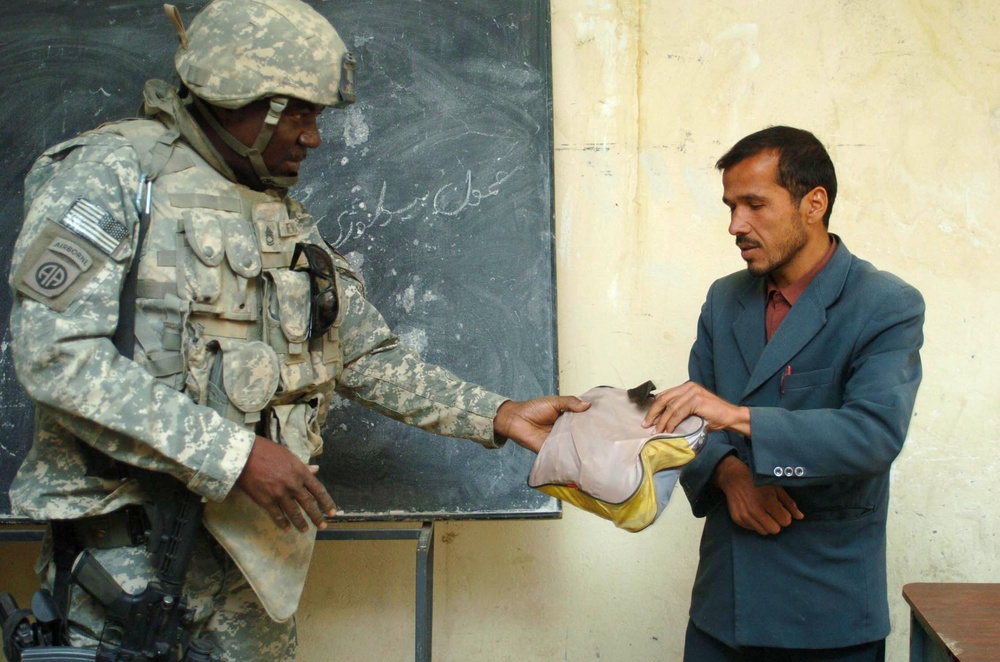 U.S. Soldier Distributes School Supplies to Afghan Teachers