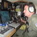 Coast Guard Petty Officer Monitors Boat Traffic from Aircraft