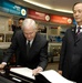 Defense Secretary Gates Signs Guest Book in South Korea