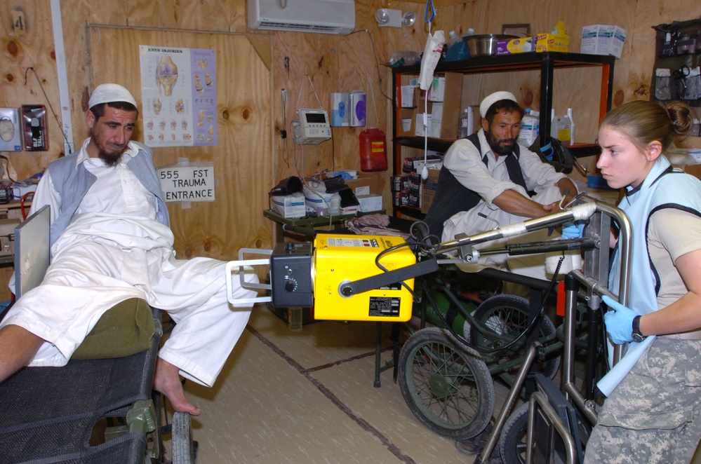 Army Medic Screens Afghan Man at Forward Operating Base