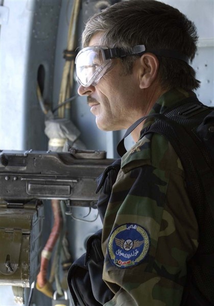 Afghan Air Corps Helicopter Gunner Keeps Watchful Eye During Mission