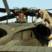 Army Officer Conducts Preflight Checks on Black Hawk Helicopter in Iraq