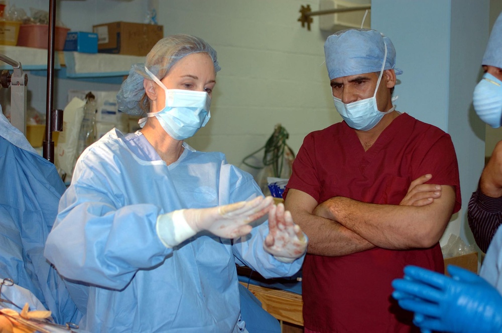Army Surgeon Collaborates with Afghan Counterpart on Village Elder's Surgery