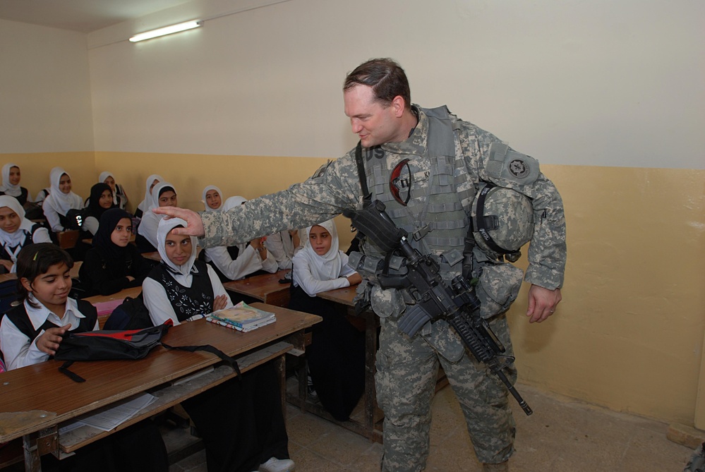 U.S. Army Officer Distributes Backpacks to Students in Baghdad