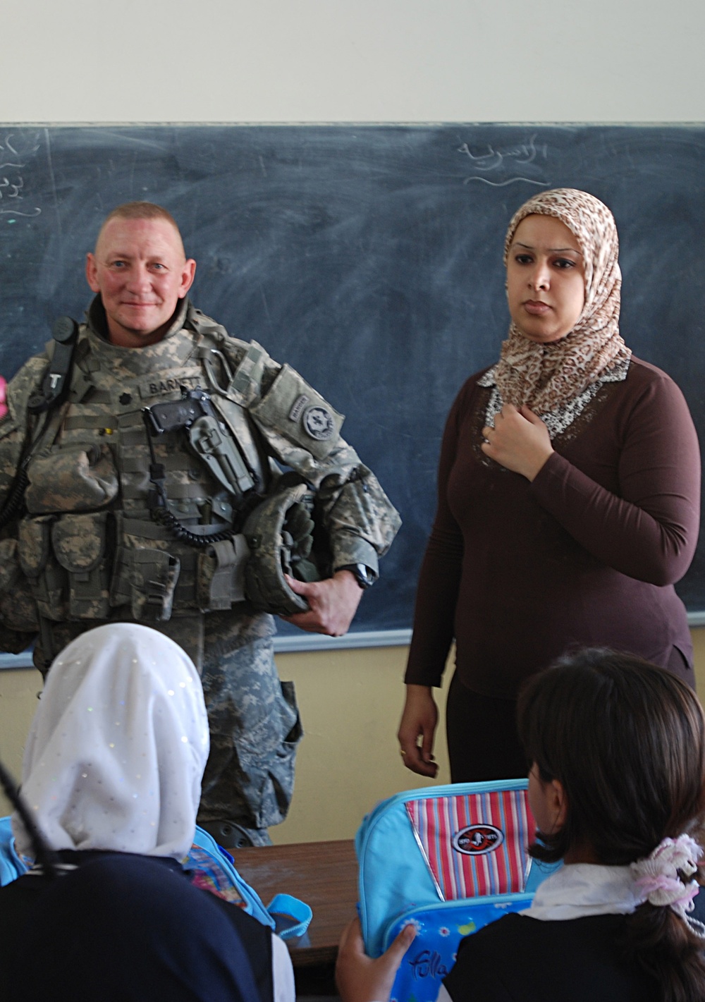 Army Officer Visits Girls' School in Baghdad, Distributes Backpacks