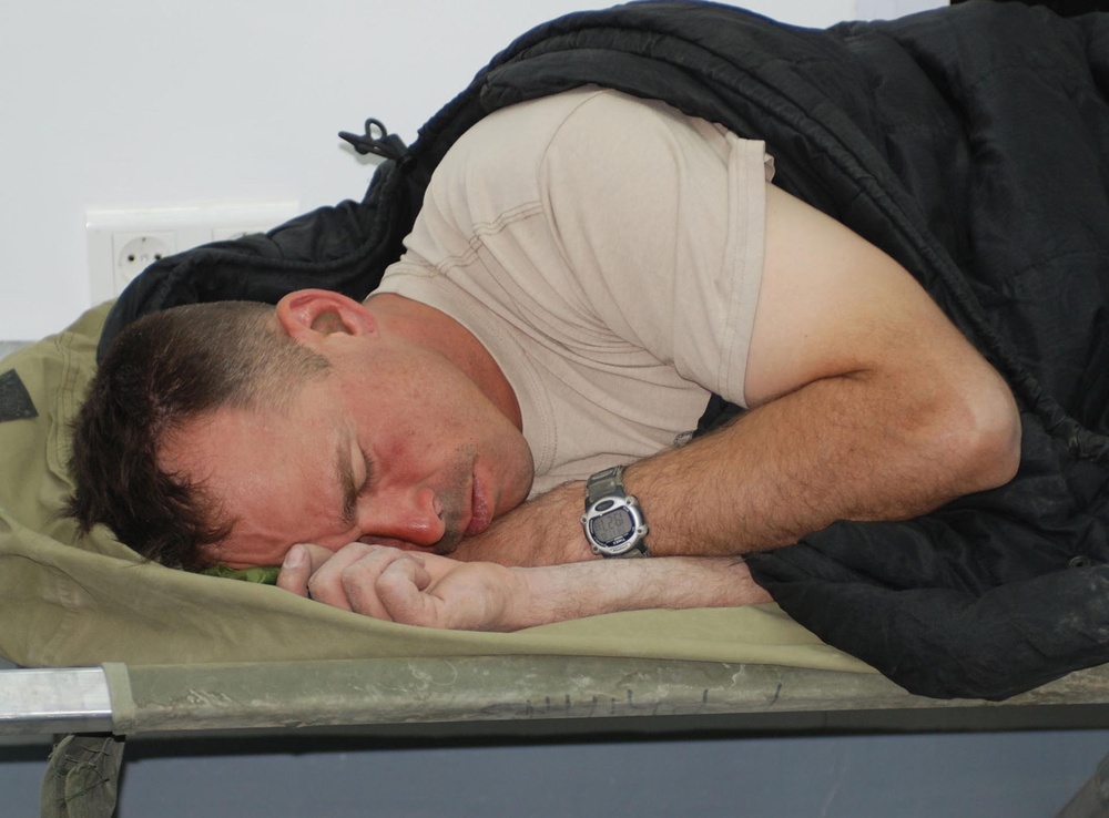 Weary Soldier Finds Rest at Bandar Command Post