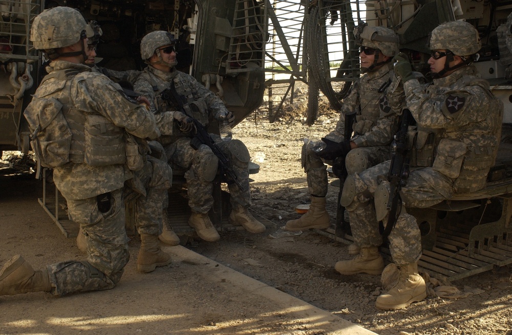 Soldiers Take Break During Baghdad Operation