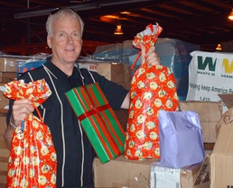 Operation Give Founder Sorts Donations for Troops Overseas