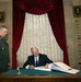 Gates Signs Guest Book at Russian General Staff Academy
