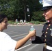 Teen Offers Water to Marine at Freedom Walk
