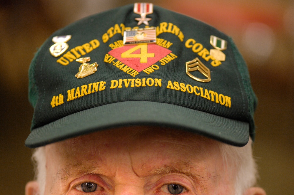 Retired Marine Veteran Displays Iwo Jima Hat at Reunion