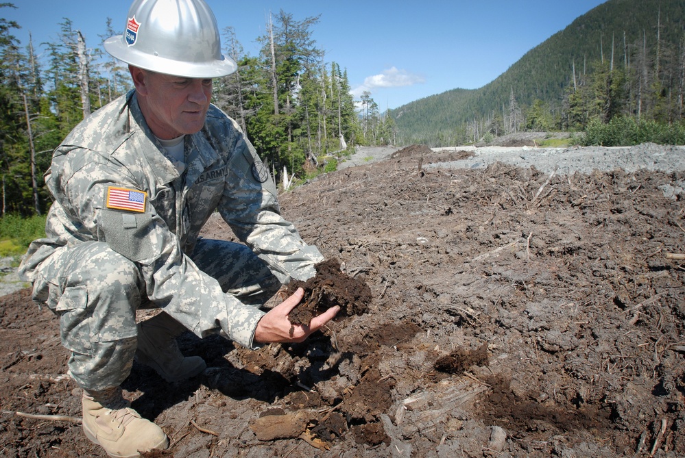 National Guard Colonel Examines Muskeg During Alaska Road Construction