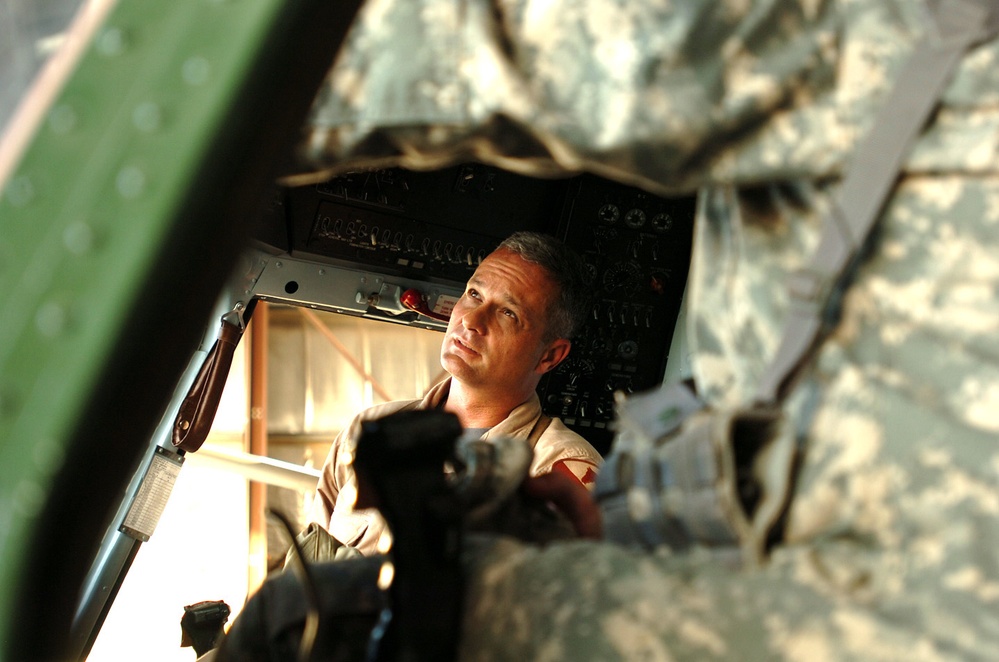 U.S. Army Officer Inspects Iraqi Air Force Helicopter