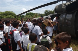 Civilians and Military Personnel Collaborate on Humanitarian Aid Effort