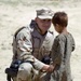 Air Force Airman Greets Afghan Child at Refugee Camp