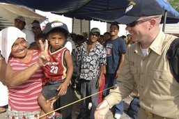 Guatemalan Mother and Son Greet U.S. Navy Lieutenant Aboard USNS Comfort Hospital Ship