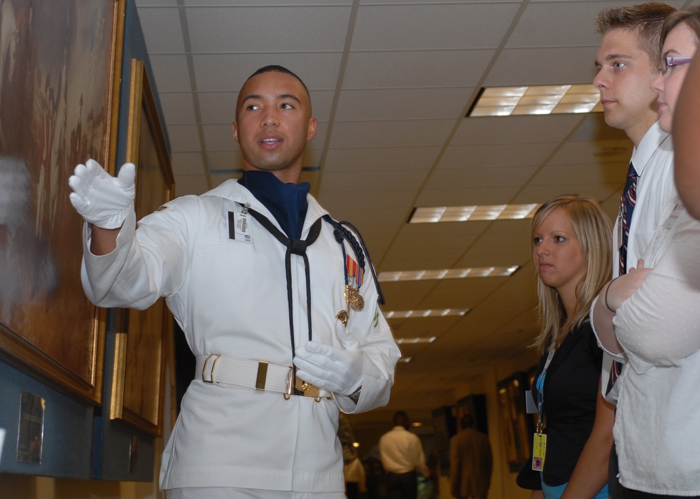 Navy Seaman Guides Pentagon Tour, Discusses Artwork