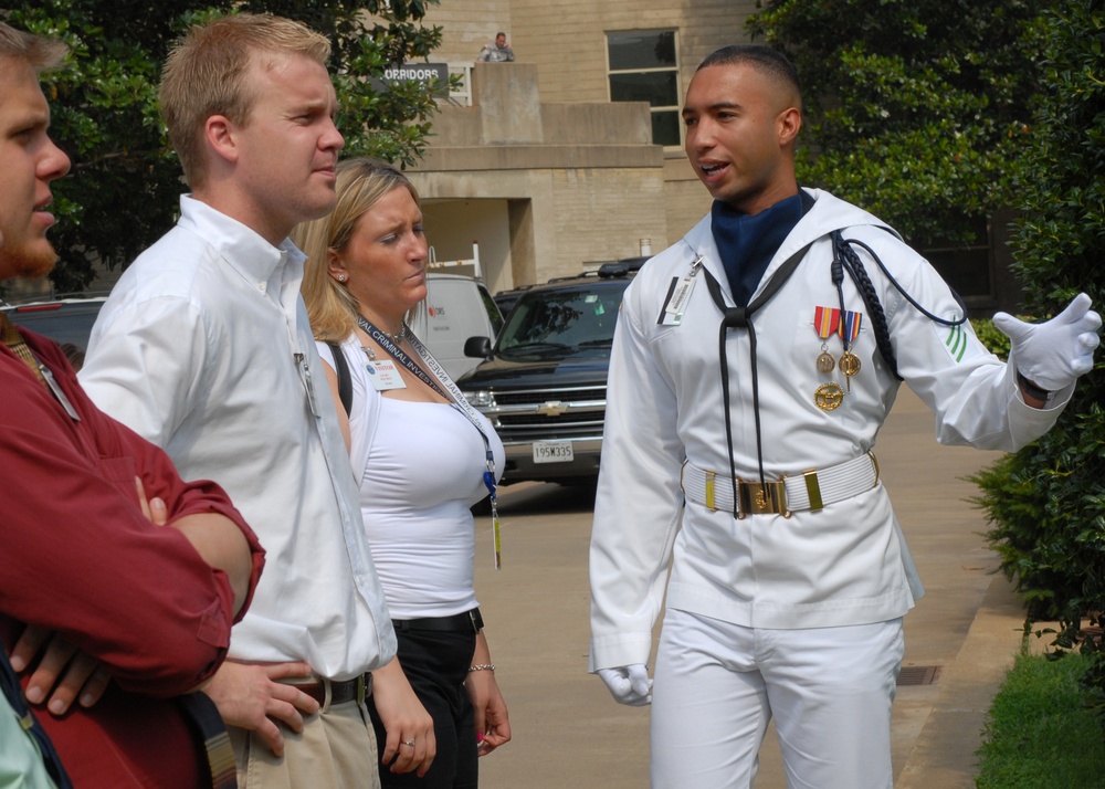 Navy Seaman Guides Visitors Through Pentagon Courtyard