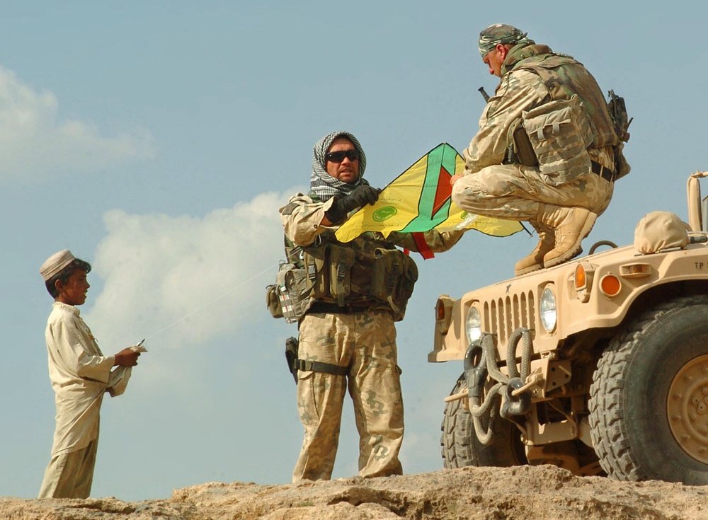 Polish Soldiers Teach Afghan Boy to Fly Kite in Ghazni