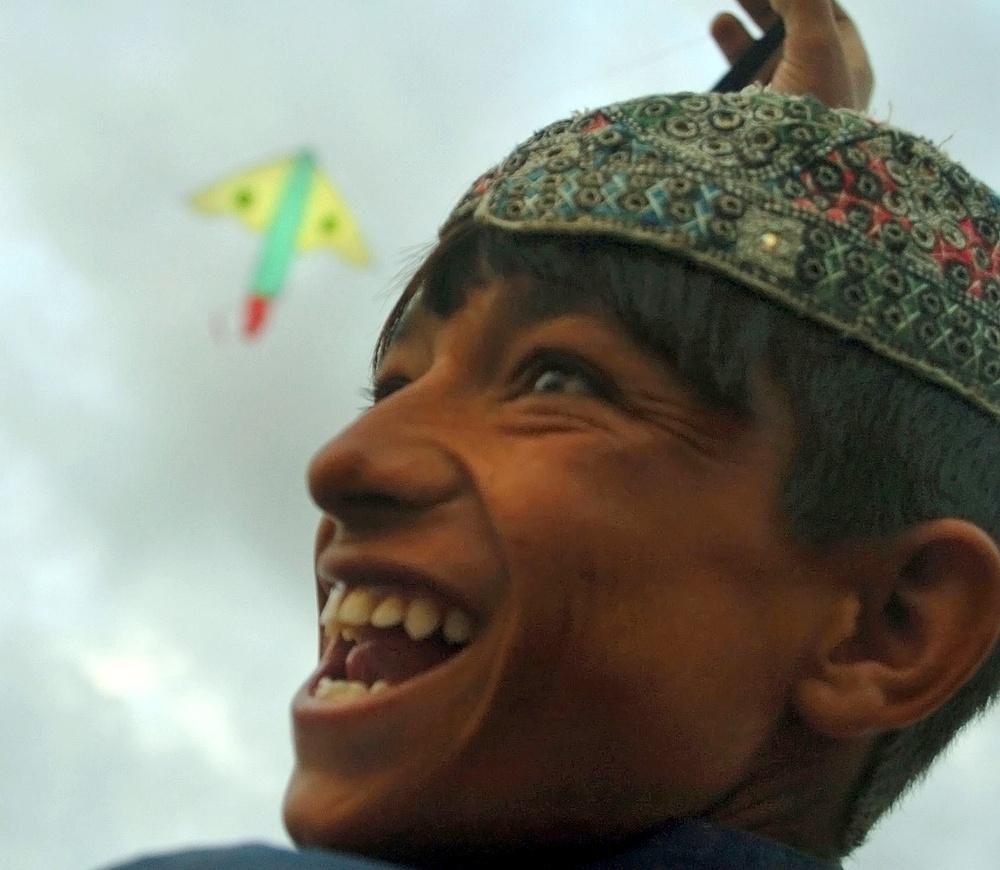 Afghan Boy Flies New Kite with Delight in Ghazni Province