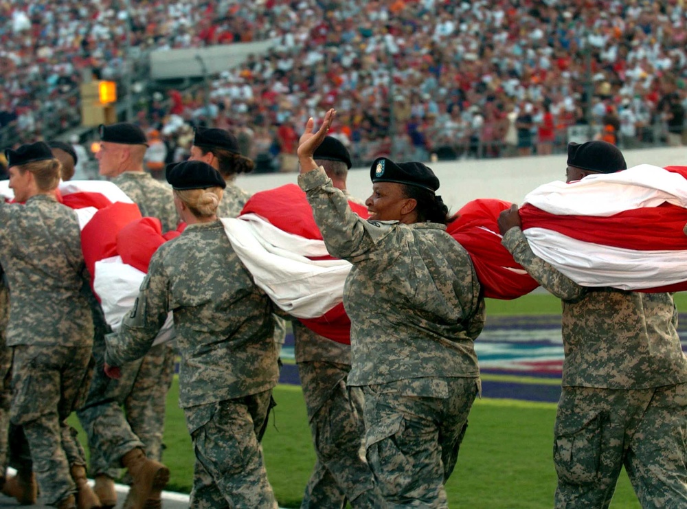 Army Soldier Carries U.S. Flag at Daytona 400