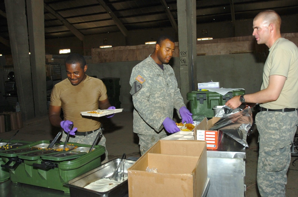 Soldiers Serve Hot Meals from Mobile Field Kitchen in Iraq